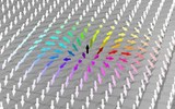 Abb.: Benjamin Krüger Die magnetische Struktur eines Skyrmions ist symmetrisch um dessen Kern; Pfeile zeigen die Richtung der Spins an.